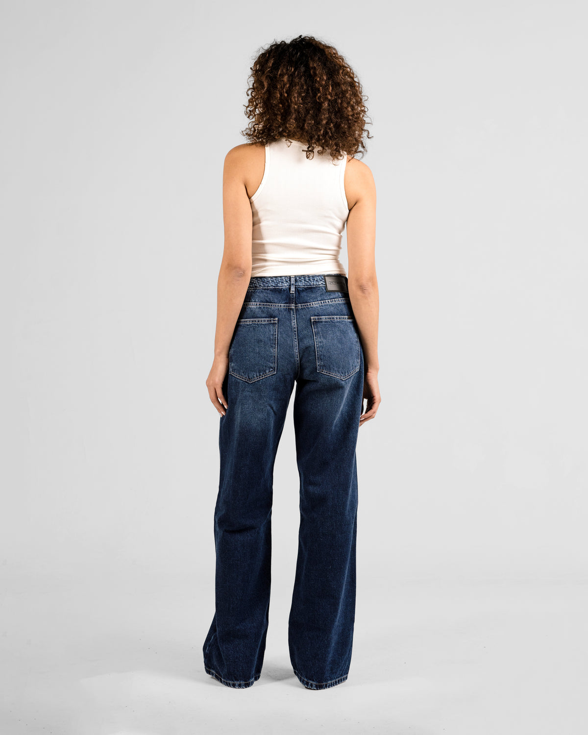 TEXTURED RELAXED MID RISE JEANS